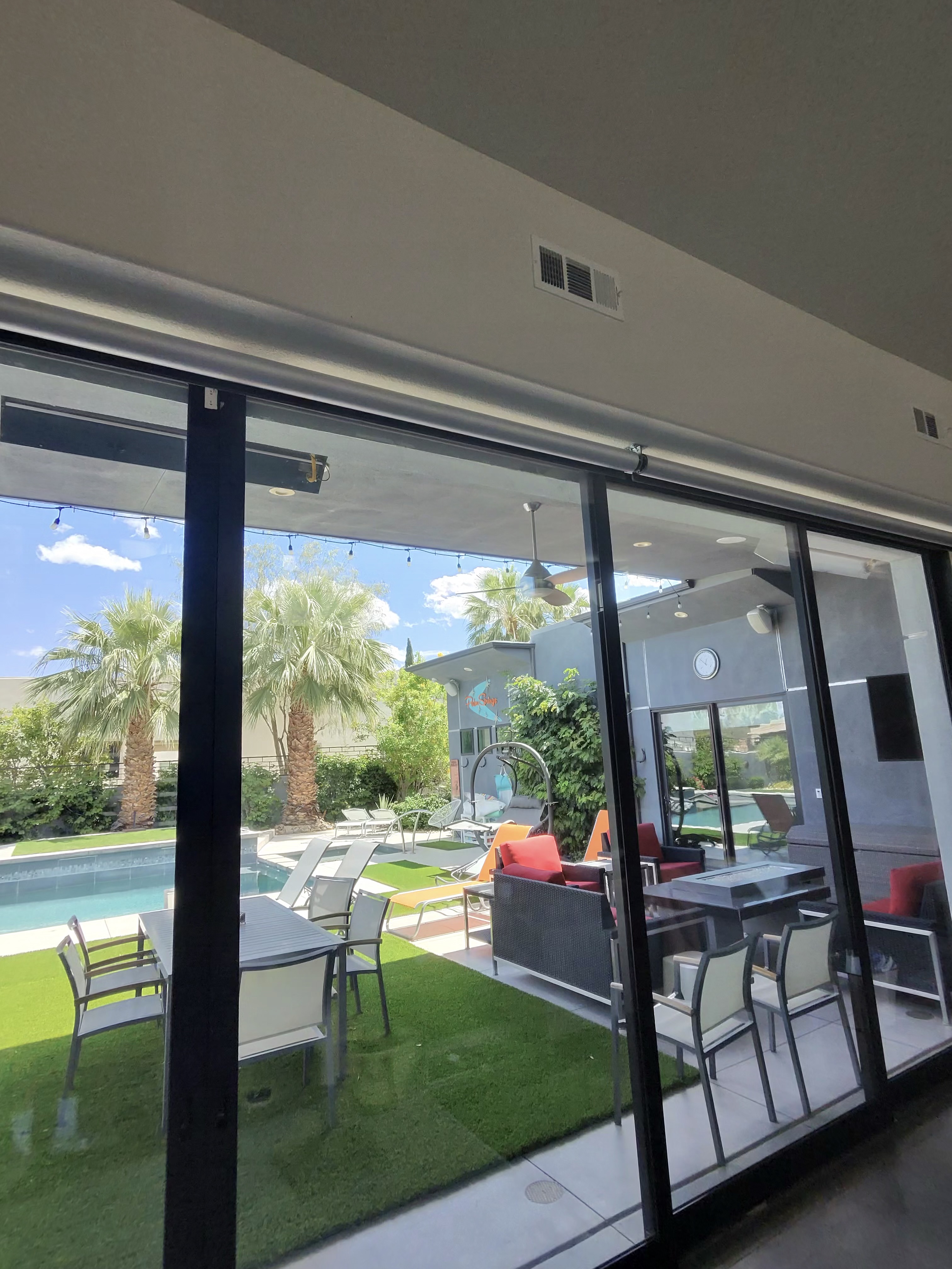 Clean sliding glass doors with a pool view in Cathedral City