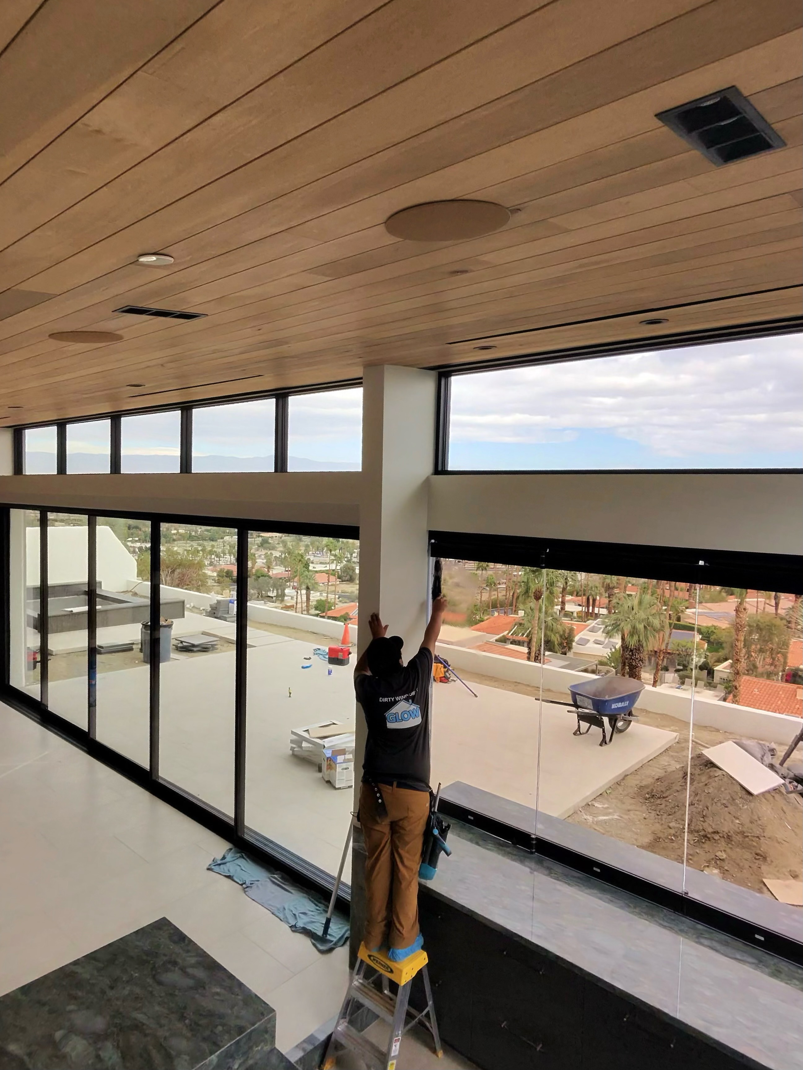 Worker cleaning panoramic windows
